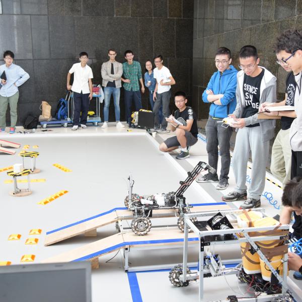 HKUST students and their robot.