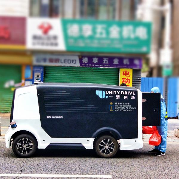 Herculus I, another slow speed unmanned parcel delivery vehicle, is delivering lunch boxes to the staff of a quarantined village in Pingshan District in Shenzhen.
