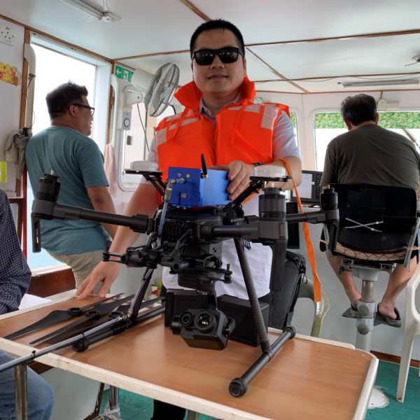 Prof. Ning and the advanced UAV (unmanned aerial vehicle) based sensor system he developed.