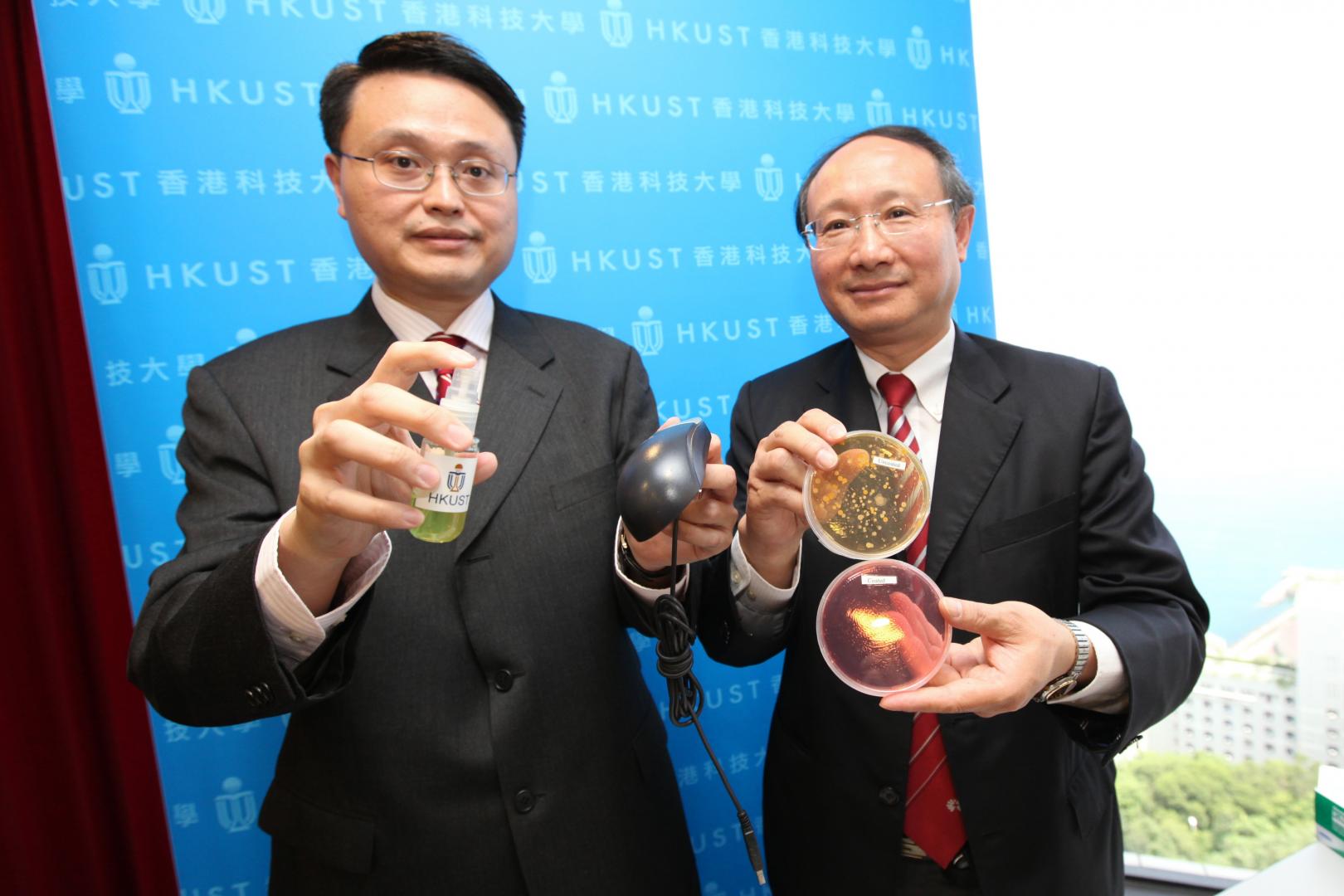 Prof King-Lun Yeung (left) demonstrates the application of the coating while Prof Joseph Kwan contrasts two laboratory samples to illustrate the efficacy of the coating	