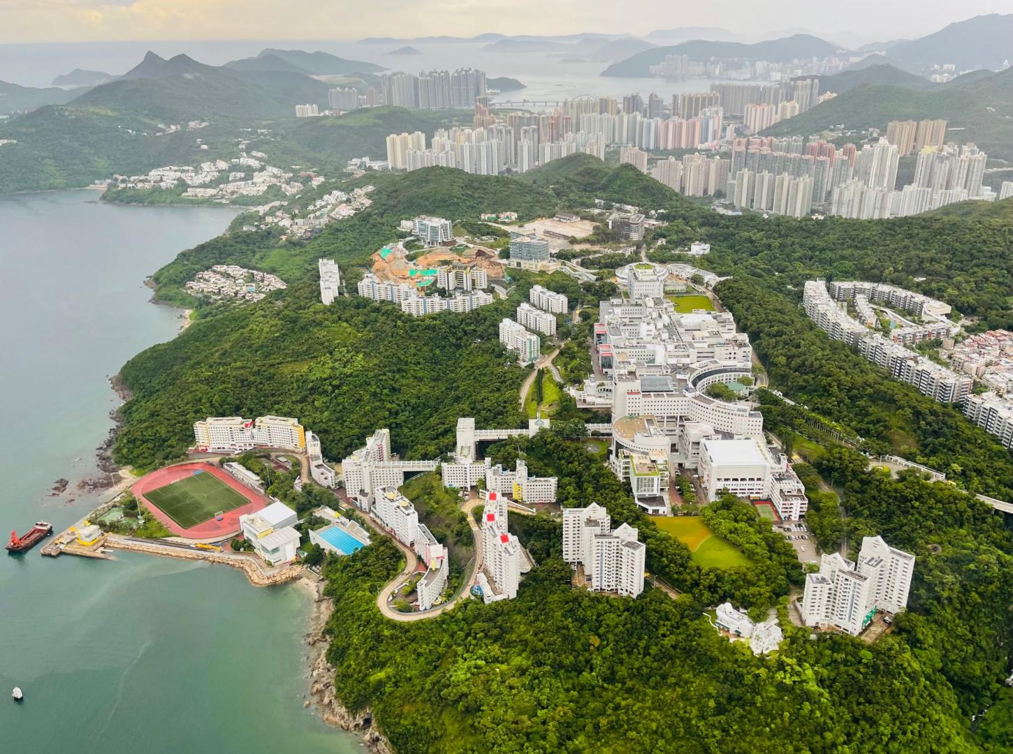 Helicopter flies over HKUST campus at Clear Water Bay.