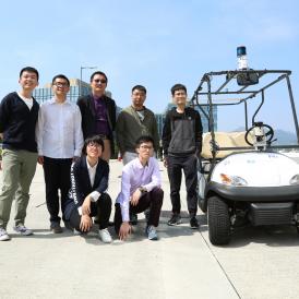 Prof Ming Liu (middle standing) and his team of students who developed the ground-breaking unmanned car.