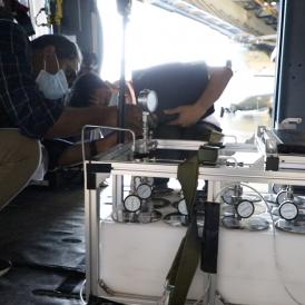HKUST researchers install the air-monitoring equipment on a modified helicopter.